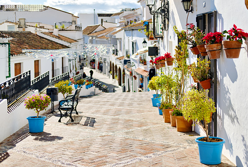 Escena idílica pintoresca calle encalado pueblo de Mijas photo