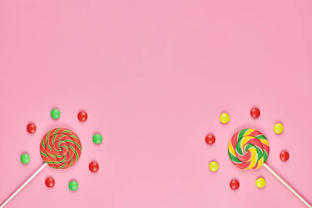 istock Sweet lollipops and candy on pink background 1206019180
