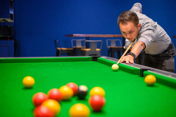 istock Asian Man playing pool in Bar 1206020544