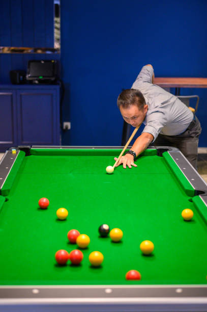 istock Asian Man playing pool in Bar 1206020581