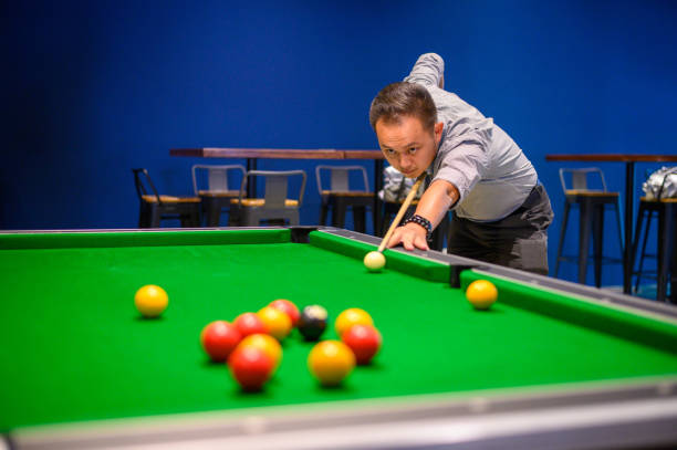 istock Asian Man playing pool in Bar 1206020597