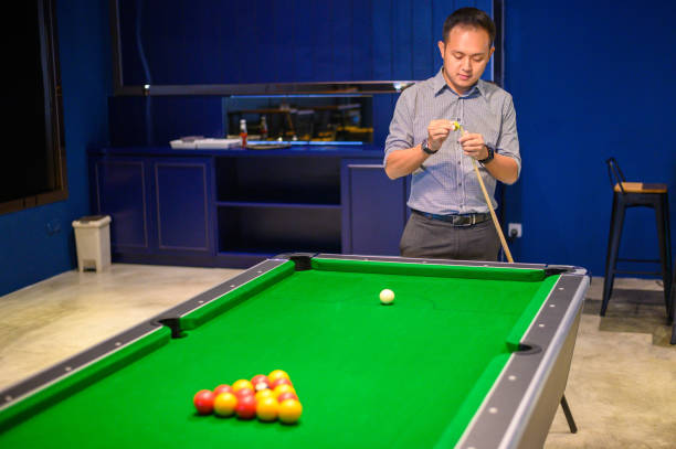 istock Asian Man playing pool in Bar 1206020929