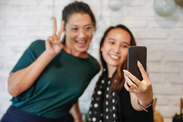 istock Millenial women taking selfie 1206021829