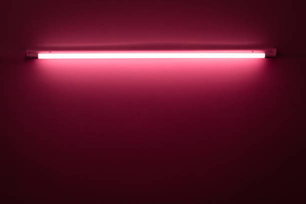 istock Pink neon lamp on a white wall 1206022870