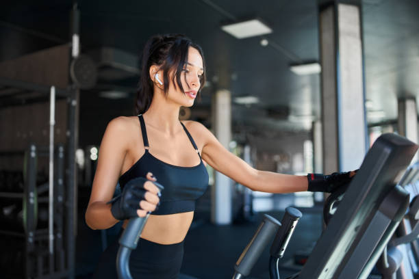 istock Fitness woman training on treadmill. 1206023704