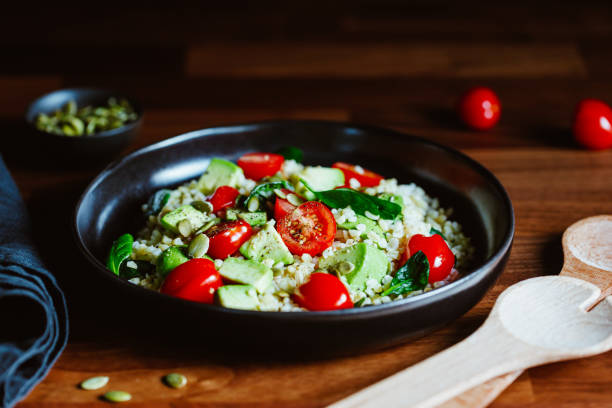 istock Healthy salad with bulgur, avocado, spinach and cherry tomatoes. 1206026328