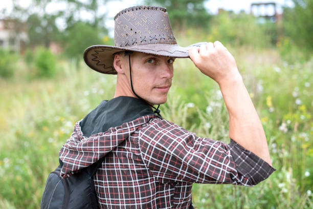 istock A man in a cowboy hat, in nature. In the field. 1206026708