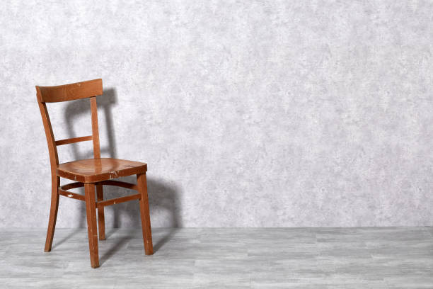 istock Brown wooden chair on gray background 1206027109