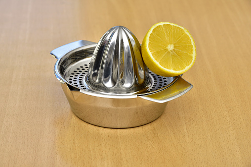 lemon on the lemon strainer/squeezer