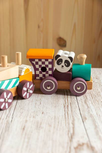 istock little wooden toy train with a panda, vertical 1206032922