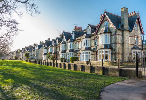 Characterful terraced houses on Park Parade facing Jesus Green in the city of Cambridge, UK.