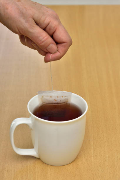 istock teabag in cup on wooden table 1206035337