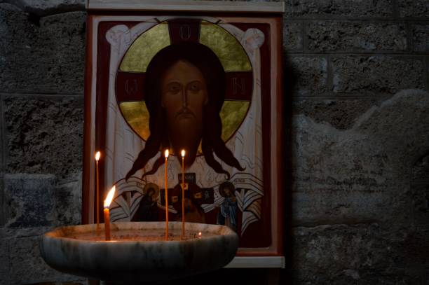 istock old jesus icon and candles 1206036181