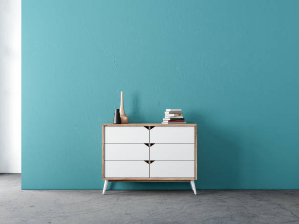 istock Modern white wooden commode mockup in empty living room with blue wall 1206039556