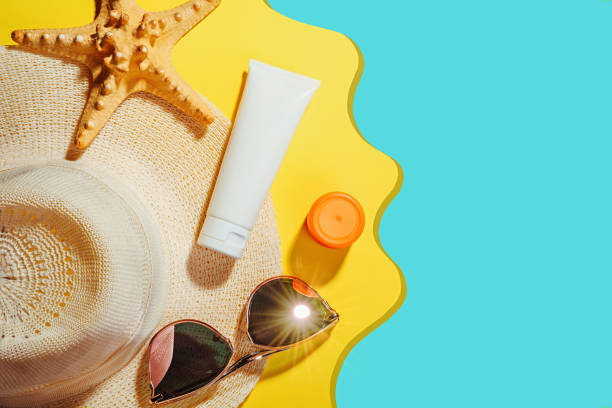 istock Sunprotection objects, sunscreen. Straw woman's hat with sun glasses and protection cream SPF Flat lay on yellow background. Beach accessories. Summer Travel Vacation Concept 1206043123
