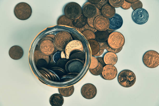 istock Money coins in the jar glass 1206043769
