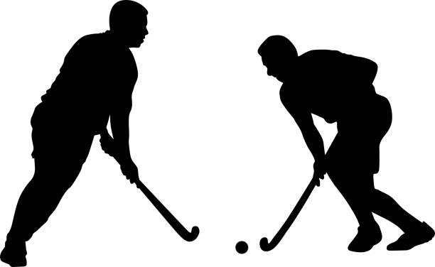 Silhouette of two field hockey players with a hockey stick and ball vector art illustration