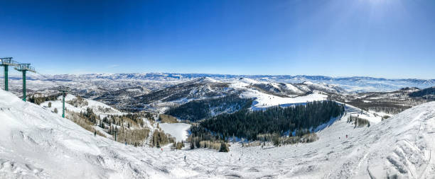 Winter mountain landscape Panoramic view of Wasatch mountains at Deer Valley ski resort from near the top of Empire lift. deer valley resort stock pictures, royalty-free photos & images