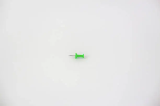 Green office pin isolated on white background