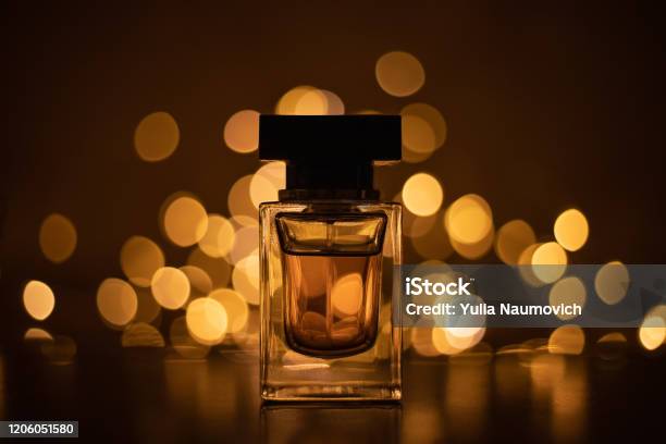 Perfume Bottle On Bokeh Lights Background Stock Photo - Download Image Now - Perfume, Scented, Luxury