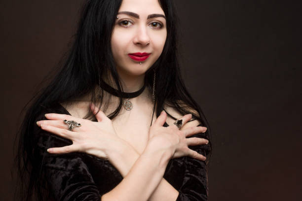 istock brunette on dark background dressed in goth style 1206053579