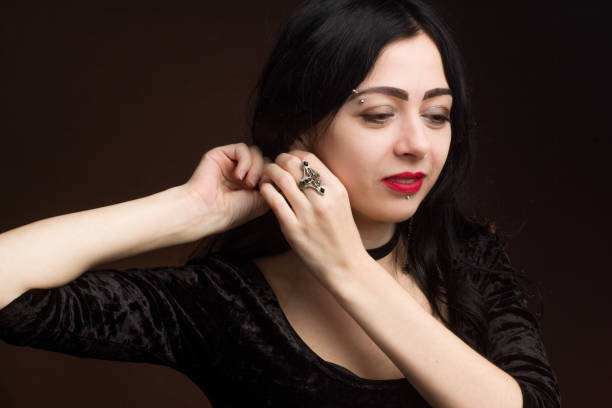 istock brunette on dark background dressed in goth style 1206053638