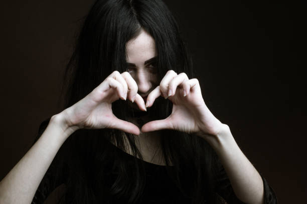 istock brunette on dark background dressed in goth style 1206053651