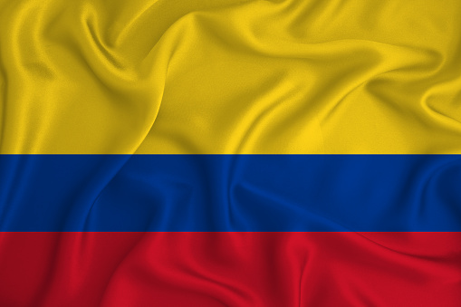 colombia flag on the background texture. Concept for designer solutions.