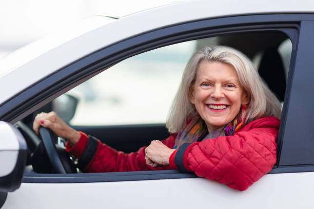 istock A woman having a good time driving her car 1206057874
