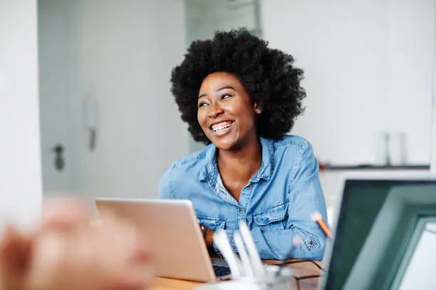 Photo of portrait young african american girl woman smiling office classroom