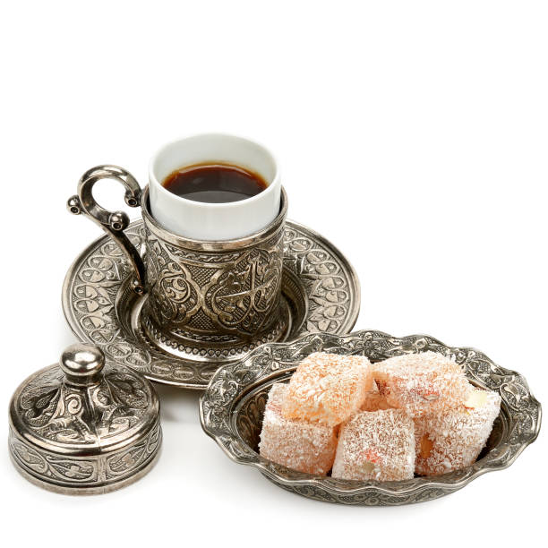 istock Aromatic black coffee in a stylish cup and Turkish delight isolated on a white background. 1206059229