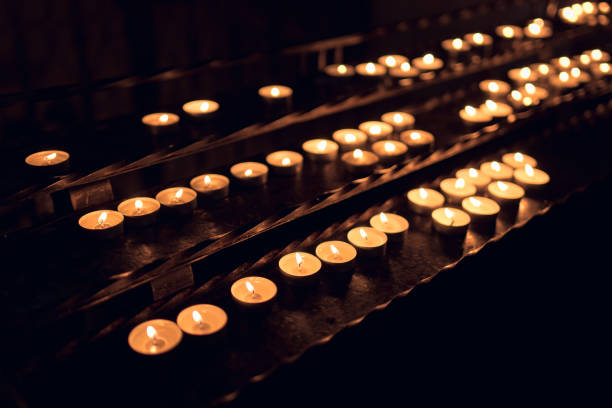 istock Many Small Candles Glowing in the Dark 1206061550