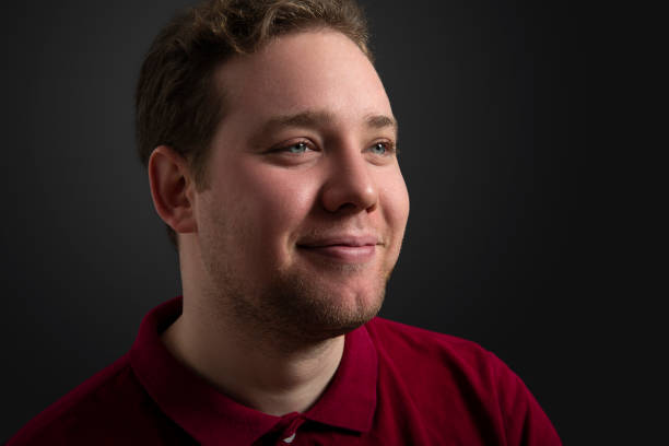 istock Portrait of handsome man over black background 1206061854