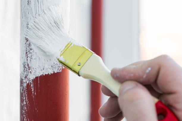 istock Worker's hand with brush that painting metal construction or pipes. 1206064969