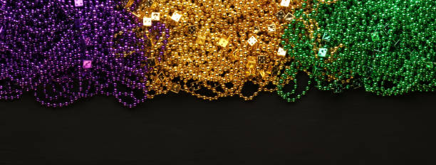 istock Purple, Gold, and Green Mardi Gras beads background 1206066869