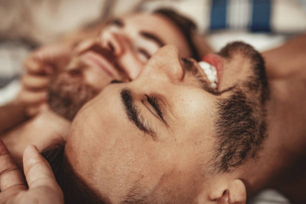 istock Gay couple at home resting and sleeping 1206067615
