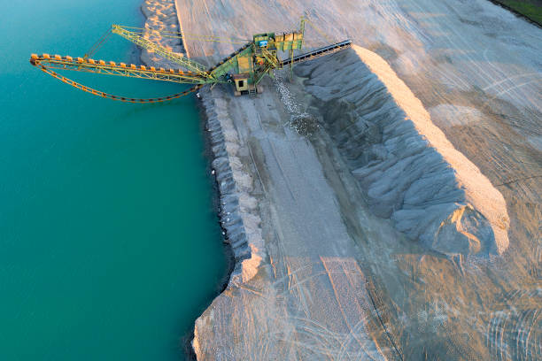 Gravel Mining Machine, Aerial View Gravel mining machine stands on the shore of the lake, aerial view. sand mine stock pictures, royalty-free photos & images