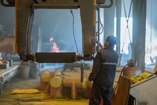 Portrait of worker working in aluminum factory