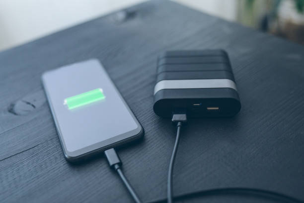 istock Charging smartphone from portable charger 1206070723