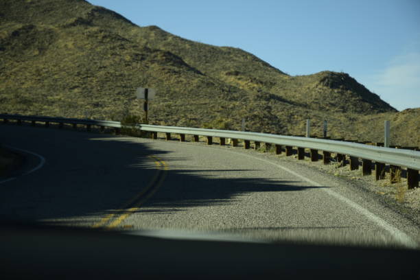 istock Curvy Road Winding Through Idyllic Desert Mountain Landscape 1206071107