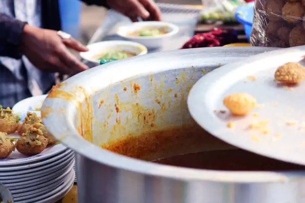 Photo of Fusca Chotpoti is Popular street food of Bangladesh and India. this food Looks like chips.a roadside shop Indian bengali food dish and pot.Testy and lucrative food.The dish consists mainly of potatoes