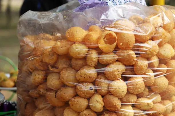 Photo of Fusca Chotpoti is Popular street food of Bangladesh and India. this food Looks like chips.a roadside shop Indian bengali food dish and pot.Testy and lucrative food.The dish consists mainly of potatoes