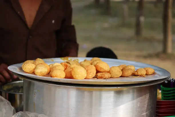 Photo of Fusca Chotpoti is Popular street food of Bangladesh and India. this food Looks like chips.a roadside shop Indian bengali food dish and pot.Testy and lucrative food.The dish consists mainly of potatoes