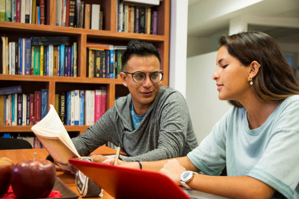 istock Latino college students in the library 1206072550