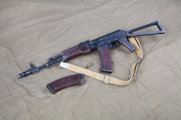 istock Kalashnikov AK 74 with ammunitions on canvas 1206072659