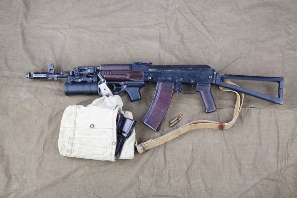 istock Kalashnikov AK 74 with underbarrel grenade launcher and ammunitions on canvas 1206072667