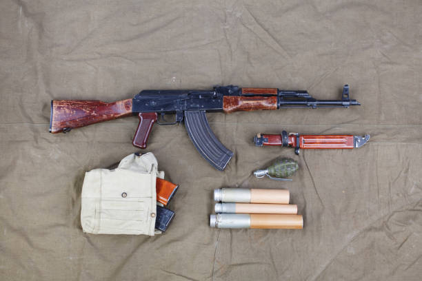 istock Kalashnikov AK 47 with ammunitions on canvas 1206072834