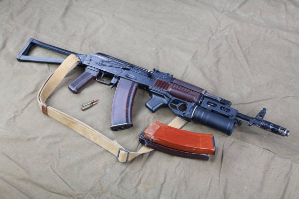 istock Kalashnikov AK 74 with underbarrel grenade launcher and ammunitions on canvas 1206072940