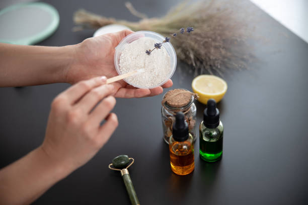 istock Young woman preparing white clay for mask 1206073600