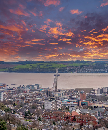 From the monument at Dundee law Hill looking down over the city to the Fourth or Tay Road Bridge Dundee Scotland at sunset